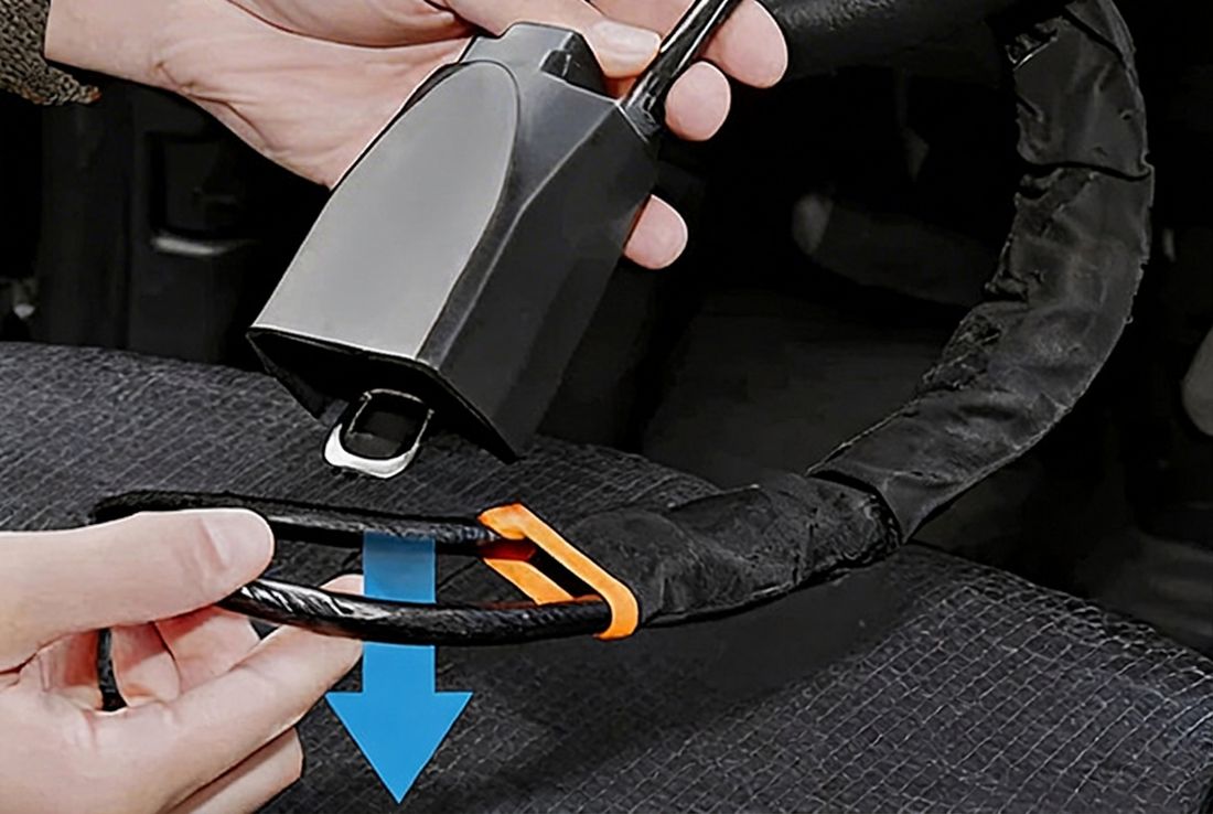 Defender cable looping through the steering wheel